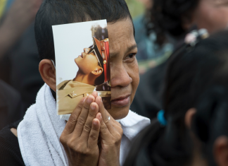 Working through grief: Thais follow king's cremation on job (Report)