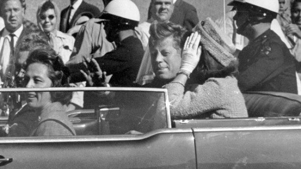 FILE - In this Nov. 22, 1963 file photo, President John F. Kennedy waves from his car in a motorcade in Dallas. Riding with Kennedy are First Lady Jacqueline Kennedy, right, Nellie Connally, second from left, and her husband, Texas Gov. John Connally, far left.  President Donald Trump, on Saturday, Oct. 21, 2017,  says he plans to release thousands of never-seen government documents related to President John F. Kennedy's assassination.  (AP Photo/Jim Altgens, File)