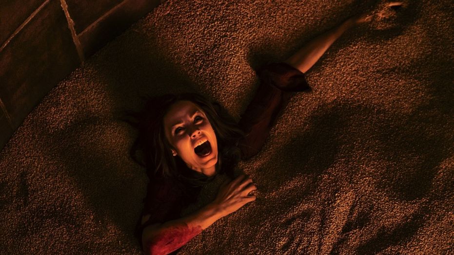 This image released by Lionsgate shows Laura Vandervoort in the horror film, "Jigsaw." (Brooke Palmer/Lionsgate via AP)