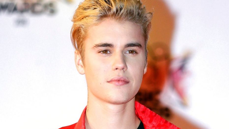 FILE - In this Nov. 7, 2015 file photo, Justin Bieber arrives at the Cannes festival palace in Cannes, southeastern France. Police say Bieber has accidentally struck a photographer with his pickup truck Wednesday night in Beverly Hills. (AP Photo/Lionel Cironneau, File)