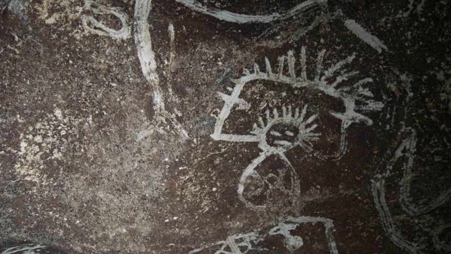 Indigenous rock art from Mona island. Note how the artist uses the contrast between the darker cave wall and the white design (Project El Corazon del Caribe)