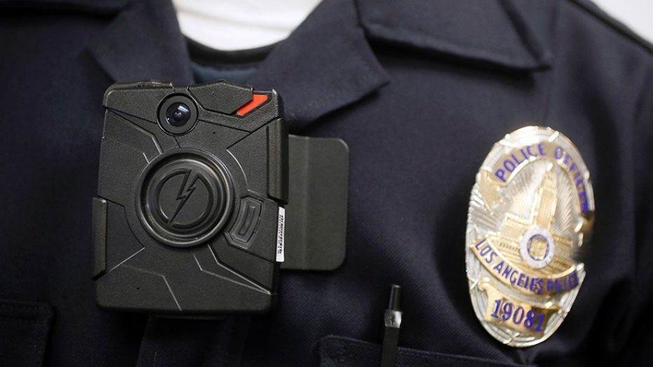 A Los Angeles police officer demonstrates the use of a body camera, Jan. 15, 2014.