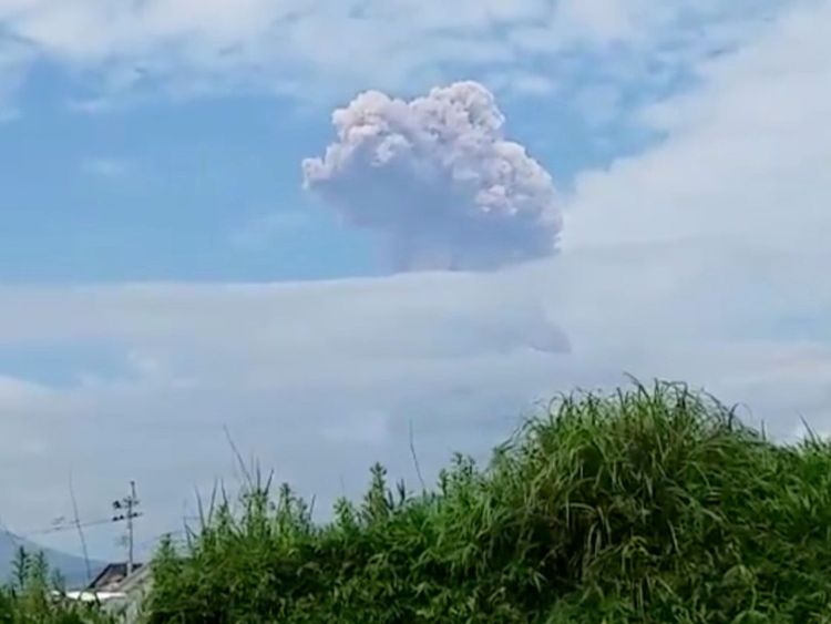 Shinmoedake peak erupting between Miyazaki and Kagoshima prefectures in southwestern Japan