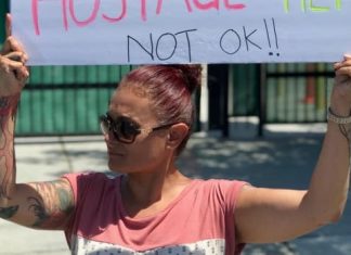 At a migrant detention facility for children in California, a protest of two (Report)