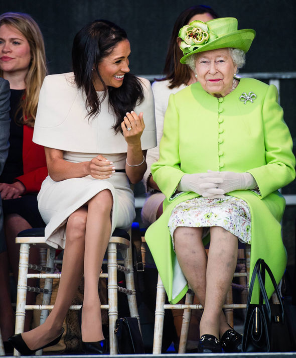 Meghan struggled to contain her laughter as she shared a joke with the Queen