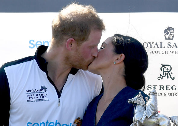 Meghan and Harry kiss after his polo match in July 