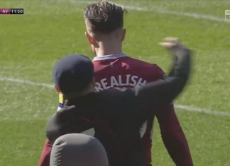 Jack Grealish punched from behind by pitch invader mid-match (Watch) Jack Grealish punched from behind by pitch invader mid-match (Video)