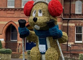 Town’s Christmas display splits opinion with giant neon marmot Town's Christmas display splits opinion with giant neon marmot
