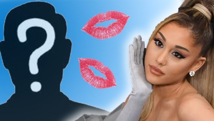 Ariana Grande shares a kiss with a mystery man, Report