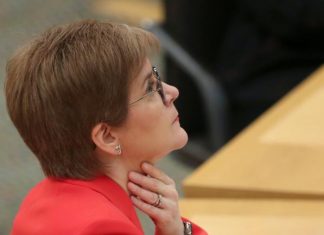 Nicola Sturgeon apologises for breaking mask rules at funeral, Report Nicola Sturgeon apologises for breaking mask rules at funeral, Report