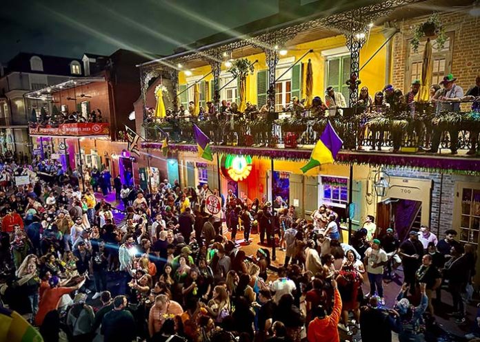 Help me plan for Mardi Gras in New Orleans—what's the parade schedule, and what are must-try foods and drinks during the festivities?